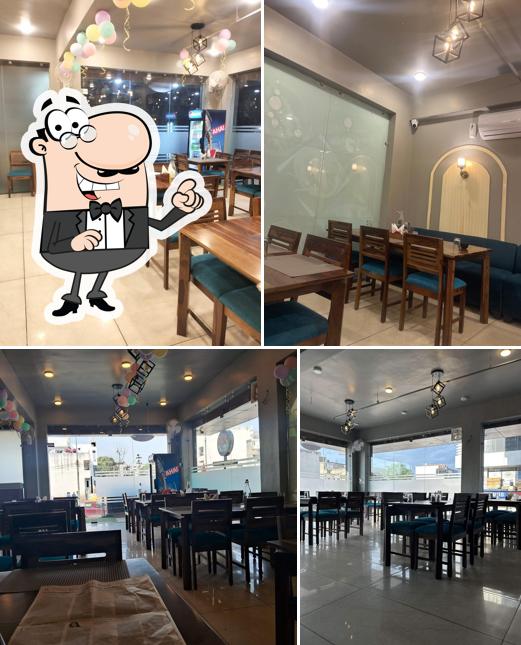 Take a seat at one of the tables at Jaipur Zaika Restaurant (Best Veg Restaurant Best Banquet Hall Top Family Restaurant in Jaipur