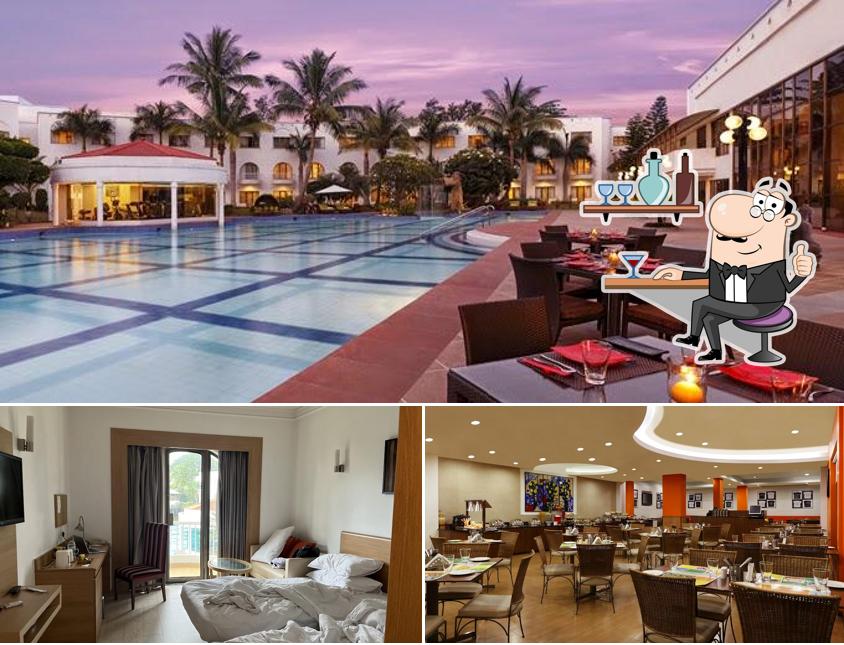 Take a seat at one of the tables at Lemon Tree Hotel, Aurangabad