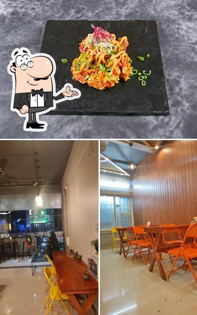 Take a look at the image depicting interior and food at Spice Berg Multi Cuisine Restaurant