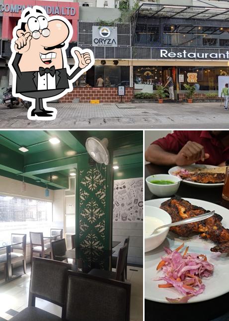 Take a seat at one of the tables at Oryza classic Restaurant