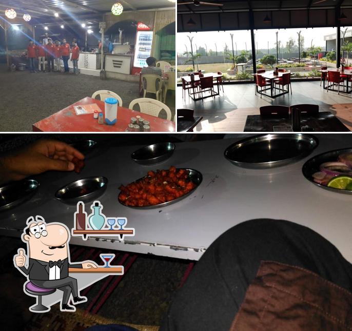 Take a seat at one of the tables at Chandni Nonveg Dhaba