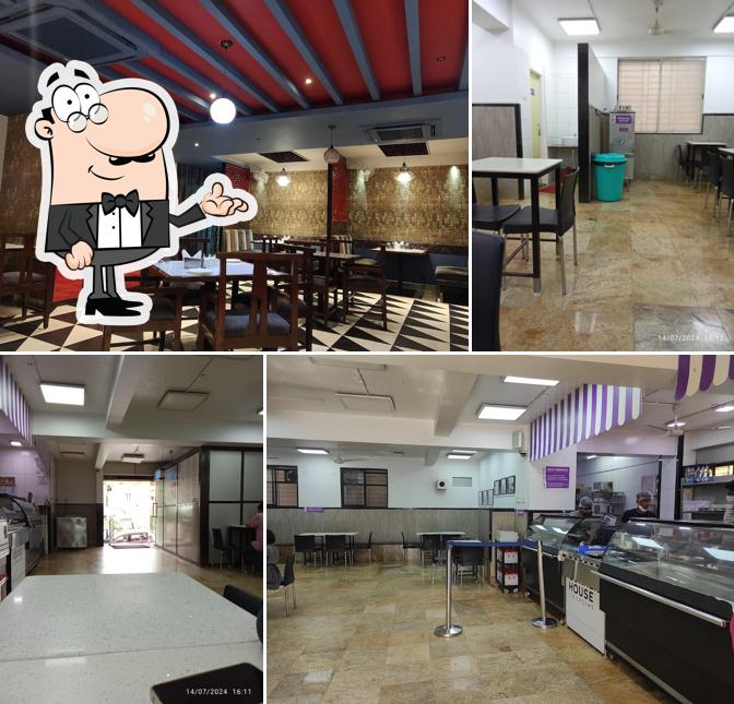 Take a seat at one of the tables at Corner House - Kasturi Nagar