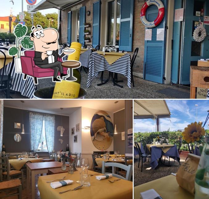 Siediti a un tavolo di La Taverna Dei Pescatori