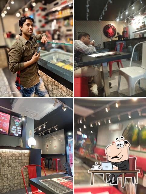 Take a seat at one of the tables at Bismillah Juice Center