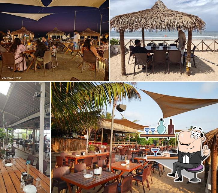 Take a seat at one of the tables at The Southern Deck - Beach Bar & Bistro