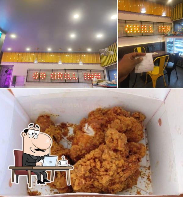 The photo of interior and food at Grill Inn