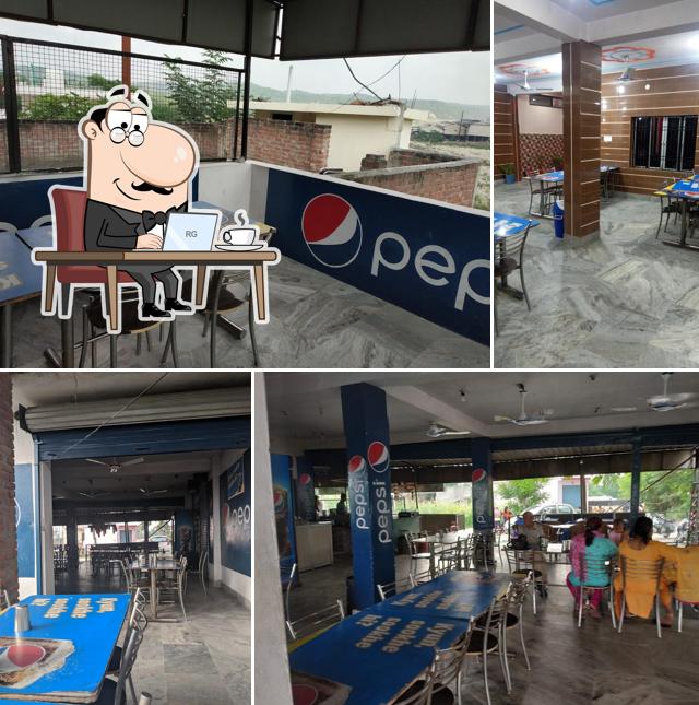 Take a seat at one of the tables at Shambu Punjabi Vaishno Dhaba