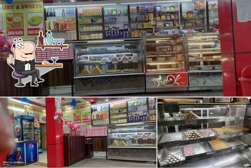 Take a seat at one of the tables at Pradhan Shah Ji Dairy & Sweets