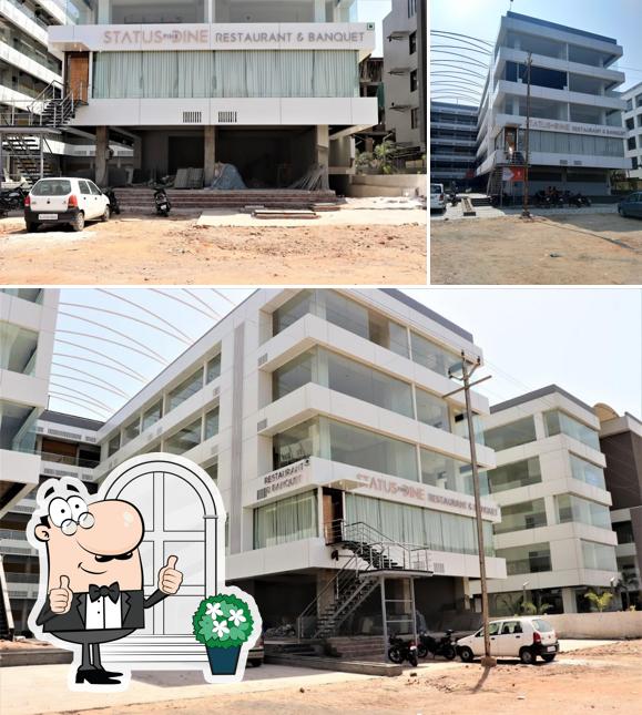 The exterior of Status Fine Dine Restaurant & Banquet