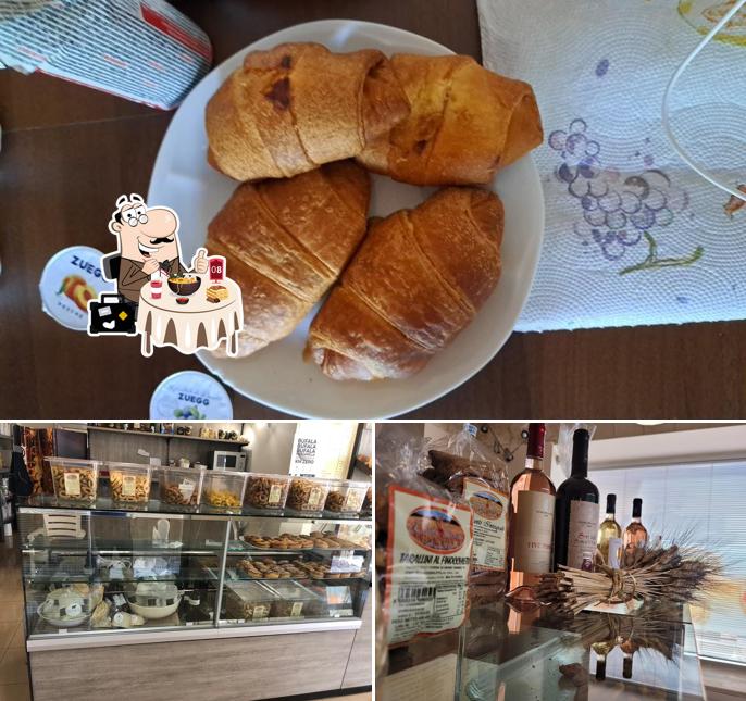 Questa è la immagine che mostra la cibo e interni di Dolce Forno