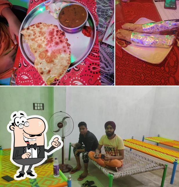 Take a seat at one of the tables at Sardar jee highway restaurant and dhaba