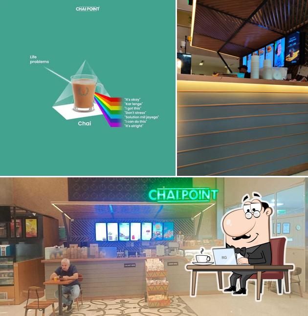 Take a seat at one of the tables at Chai Point - Metro Hospital, Faridabad