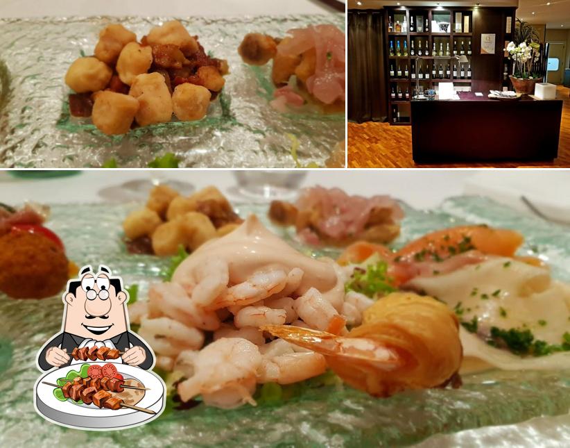 La foto di cibo e bancone da bar da Baccanti Ristorante - Parco dei Pini Sala Ricevimenti