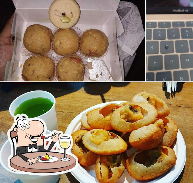 Take a look at the photo showing food and interior at Narula