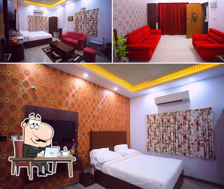 Take a seat at one of the tables at Domus Regency by ShriGo Hotels