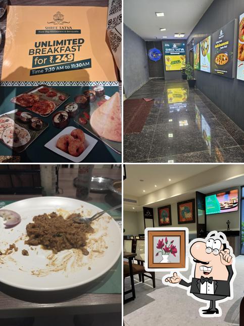 Take a seat at one of the tables at SHREE TATVA PURE VEGETARIAN RESTAURANT AND