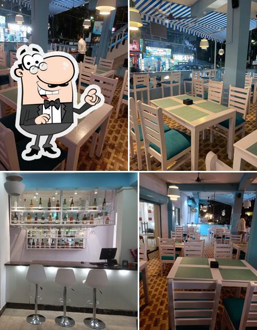 Take a seat at one of the tables at KARMA SHOOTERS