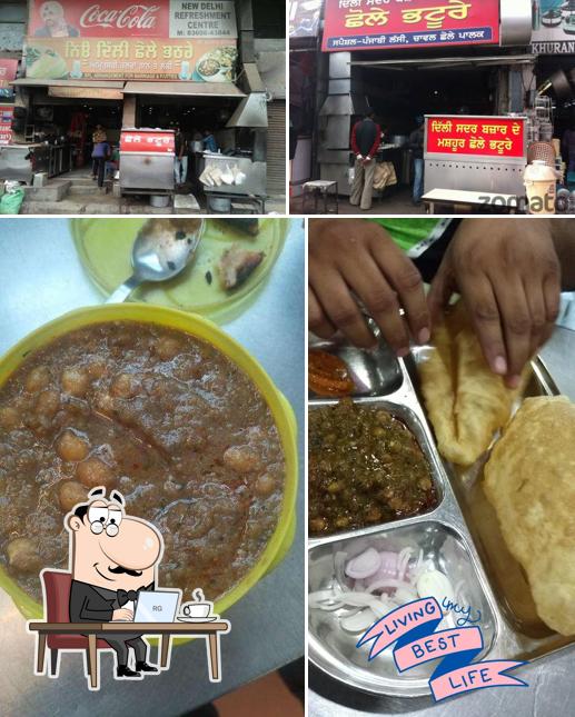 Take a seat at one of the tables at NEW DELHI CHHOLE BHATURE