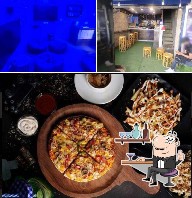 Check out the picture showing interior and pizza at Caves