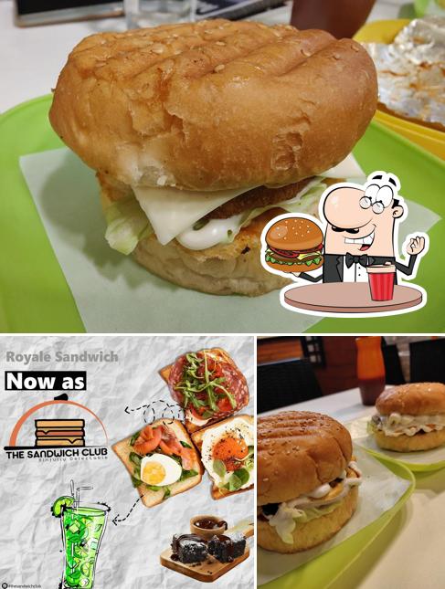 Get a burger at The Sandwich Club Sandwiches, Burgers, Momos, Wraps, Brownies, Pasta and Pizza
