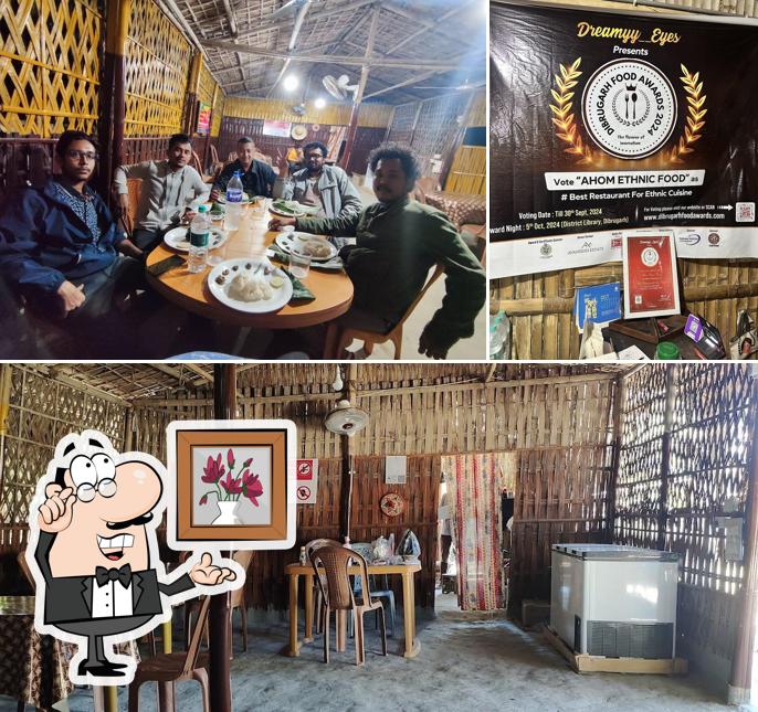 Take a seat at one of the tables at Ahom Ethnic Food (আহোম জনগোষ্ঠীৰ থলুৱা খাদ্য )