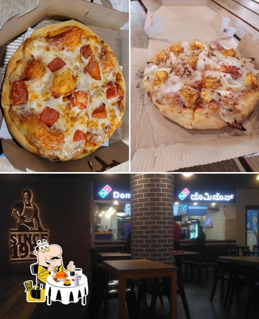 Among various things one can find food and interior at Domino's Pizza Yelahanka, Bengaluru