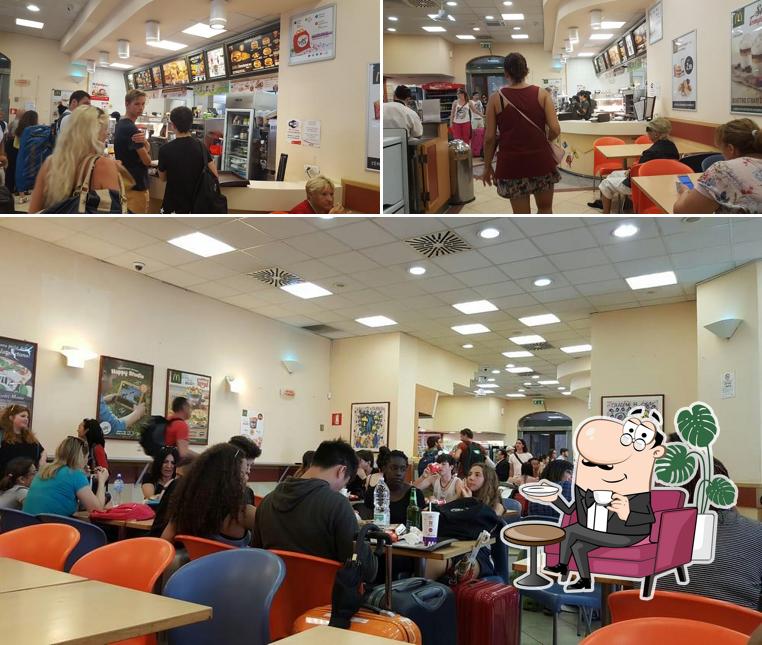 Dai un'occhiata agli interni di McDonald's Pisa Stazione