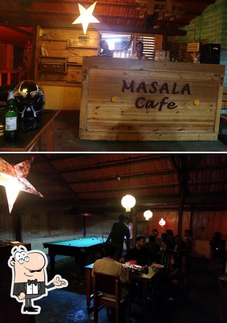 Take a seat at one of the tables at Masala Cafe