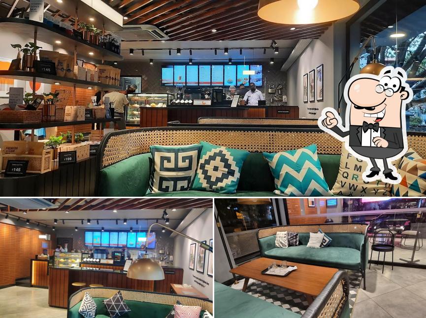 Take a seat at one of the tables at Chai Point - 1st Stage, Indira Nagar