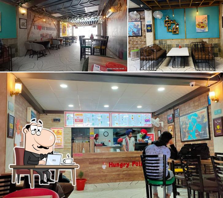 Take a seat at one of the tables at Hungry Point - Srinagar UK