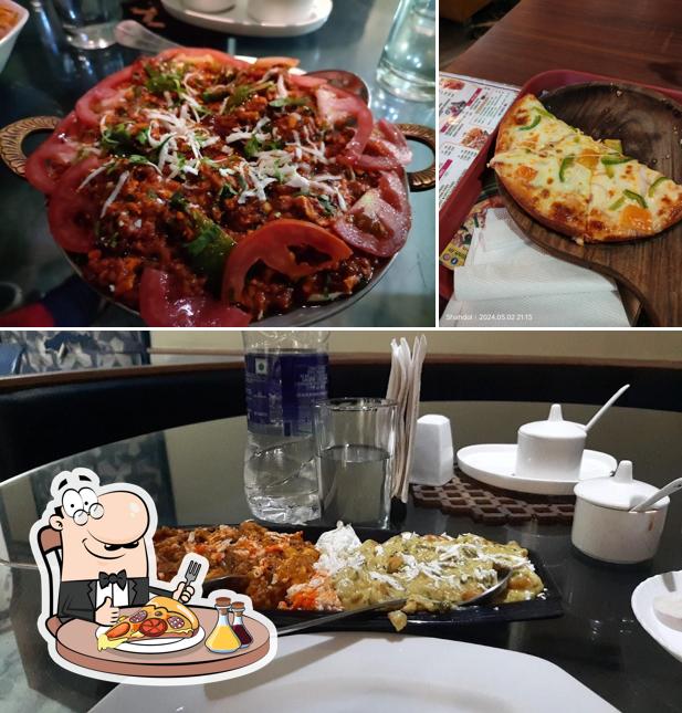 Order pizza at Oasis Restaurant