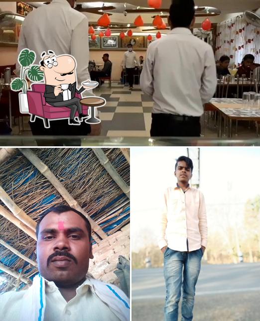 Take a seat at one of the tables at Shri Anand Family Veg Restaurant