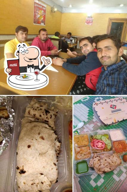 Check out the image depicting food and interior at Kisan Bhojanalaya
