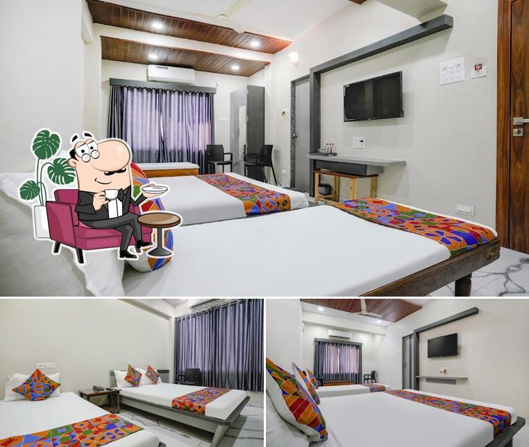 Take a seat at one of the tables at Hotel Priya Lodging