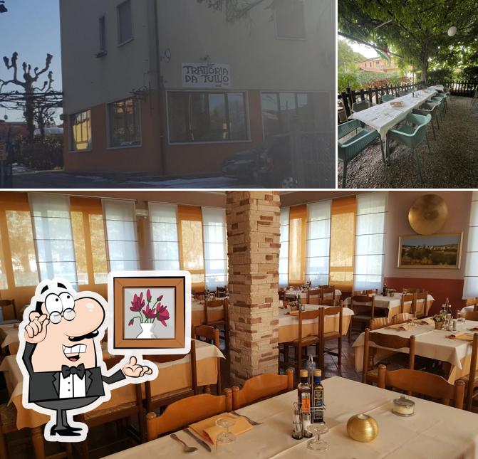 Siediti a un tavolo di Trattoria Da Tullio