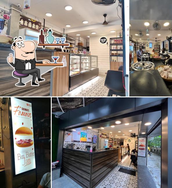 Take a seat at one of the tables at Coffee Shastra - Adyar