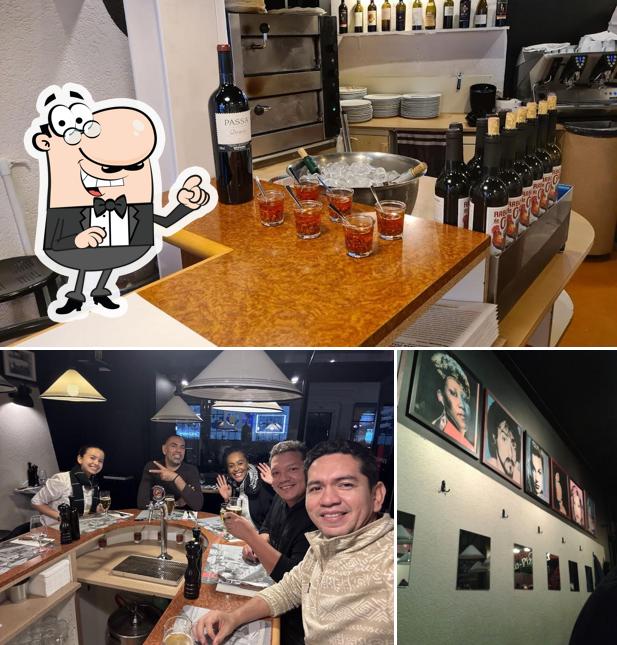 Questa è la foto che presenta la interni e vino di Espresso Club