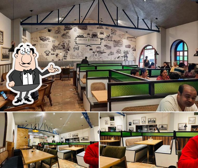 Take a seat at one of the tables at Kailash Parbat - Pure Vegetarian Restaurant