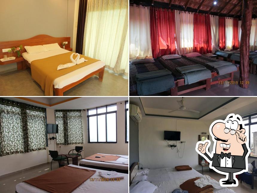Take a seat at one of the tables at Surali Sagar Beach Resort - Beach resort with swimming pool in Dapoli Karde Murud