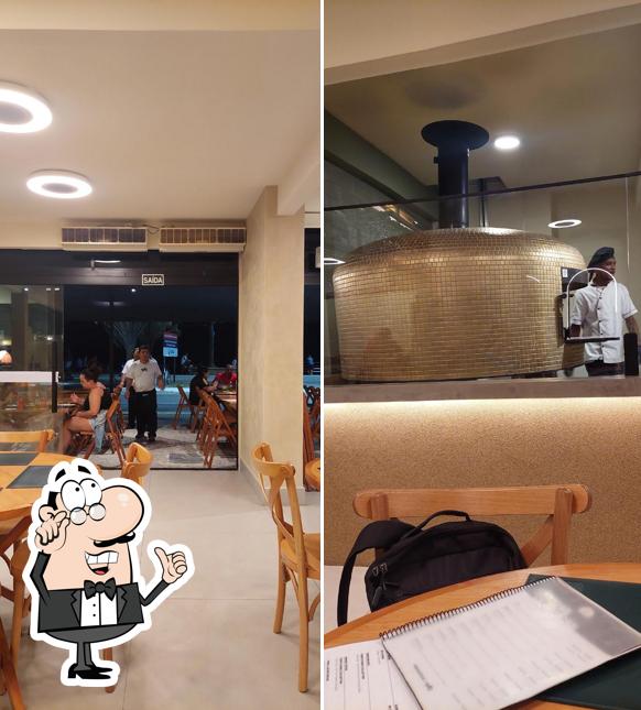 Sente em uma das mesas no Forneria 1983