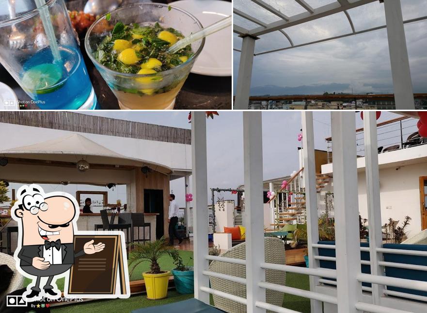 The photo of exterior and food at Aura Kitchen And Spirits