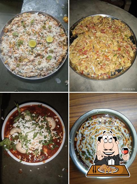 Try out pizza at Holiday Green Restaurant