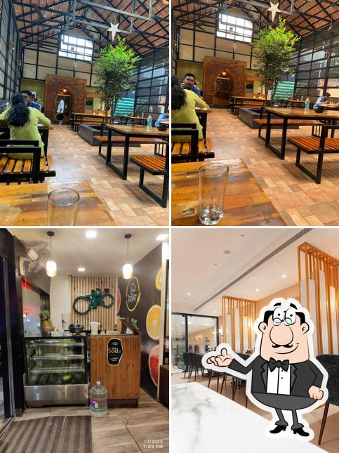 Take a seat at one of the tables at AL HAYAT RESTAURANT AND CATERERS