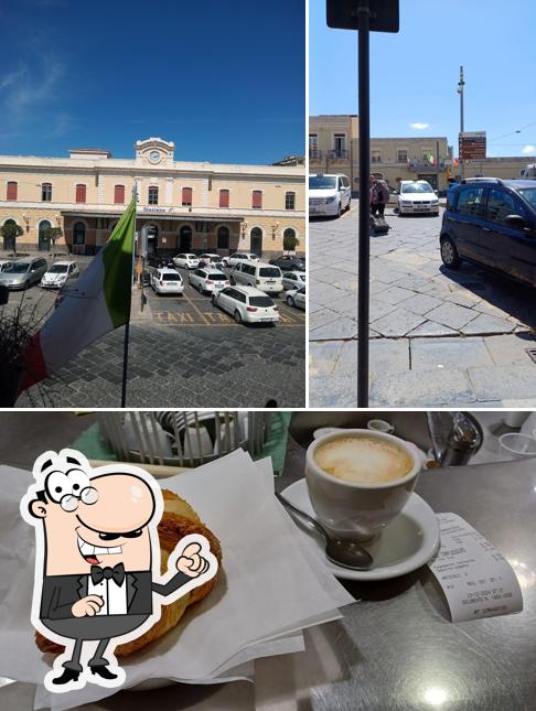 Dai un’occhiata alla foto che presenta la esterno e cibo di Bar tabacchi della stazione