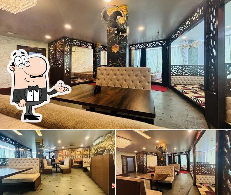 Take a seat at one of the tables at Al Bari Arabian Mandi Restaurant