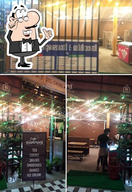 Take a seat at one of the tables at cafe sulaimani