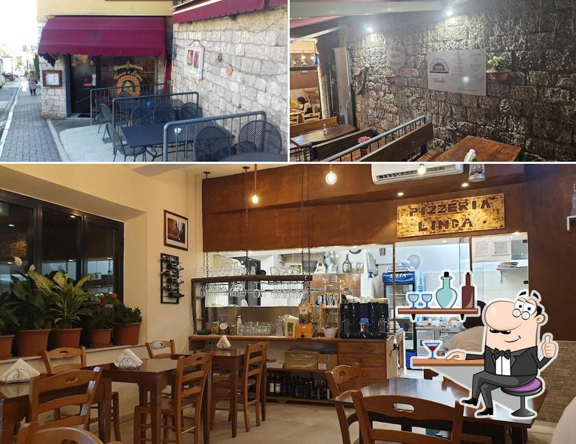 Siediti a un tavolo di Pizzeria e cucina da Linda