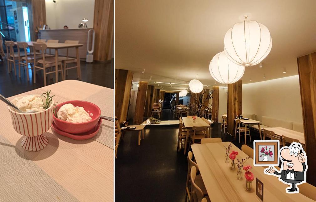 Take a seat at one of the tables at SHIZO, Cafe Restaurant