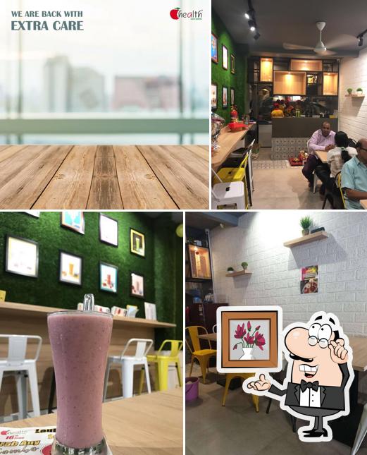 Take a seat at one of the tables at Health Juice Centre Girgaon