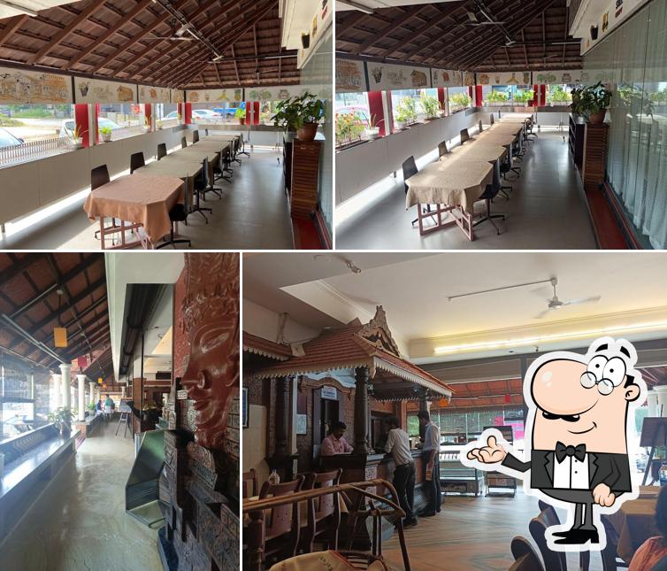 Take a seat at one of the tables at Ruchi Village Restaurant